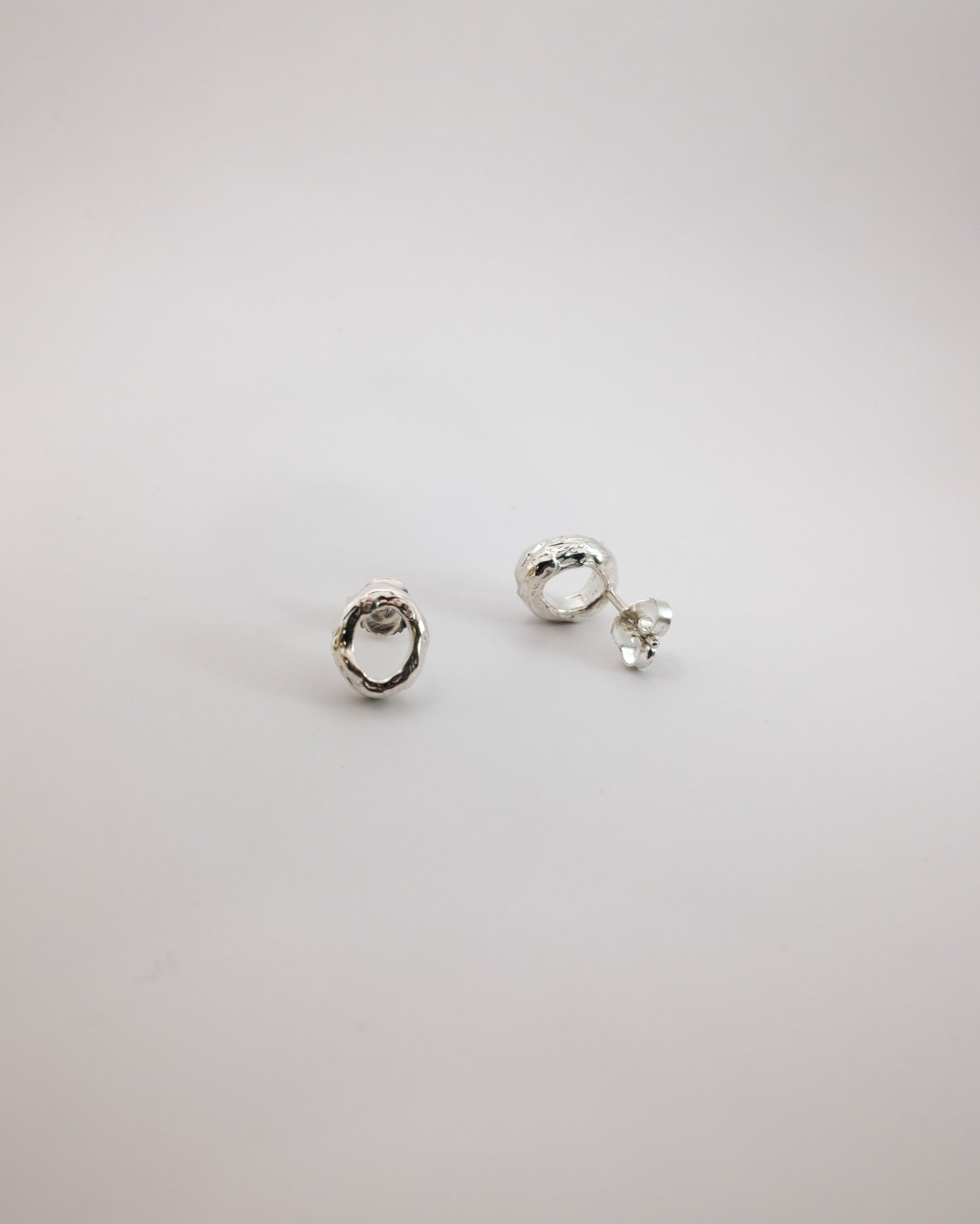 Pair of handmade unique silver earrings in Berhel studio in Helsinki