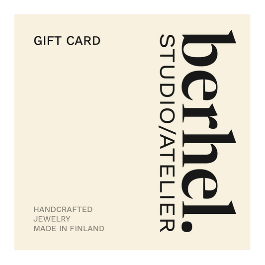 Gift card for Berhel Studio/Atelier jewelry with brand name and location on a beige background