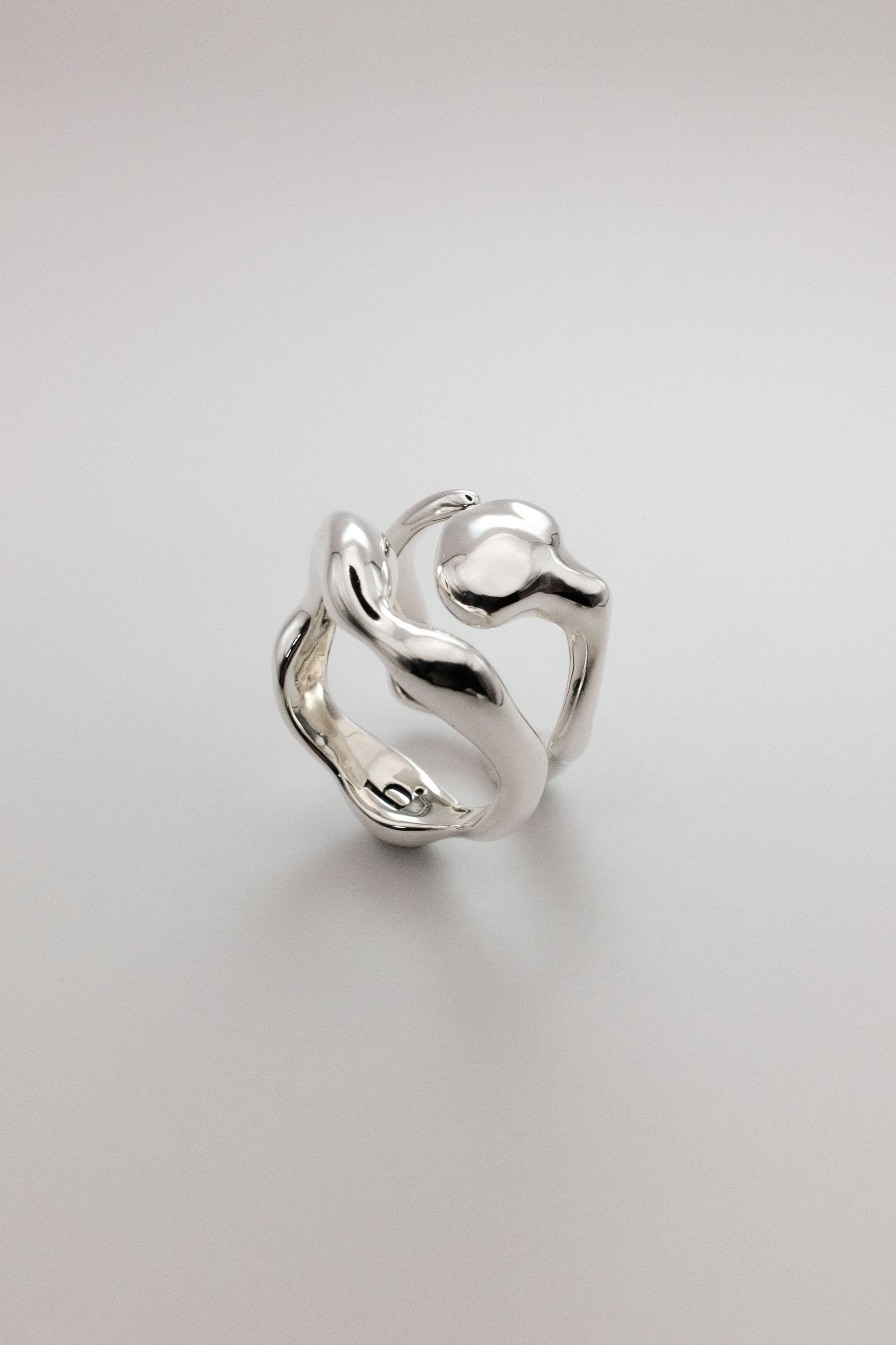 Organically shaped pair of silver rings shot in studio